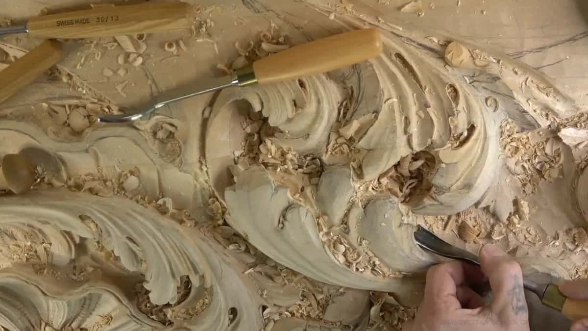 Long bent shank lying across the carved board.