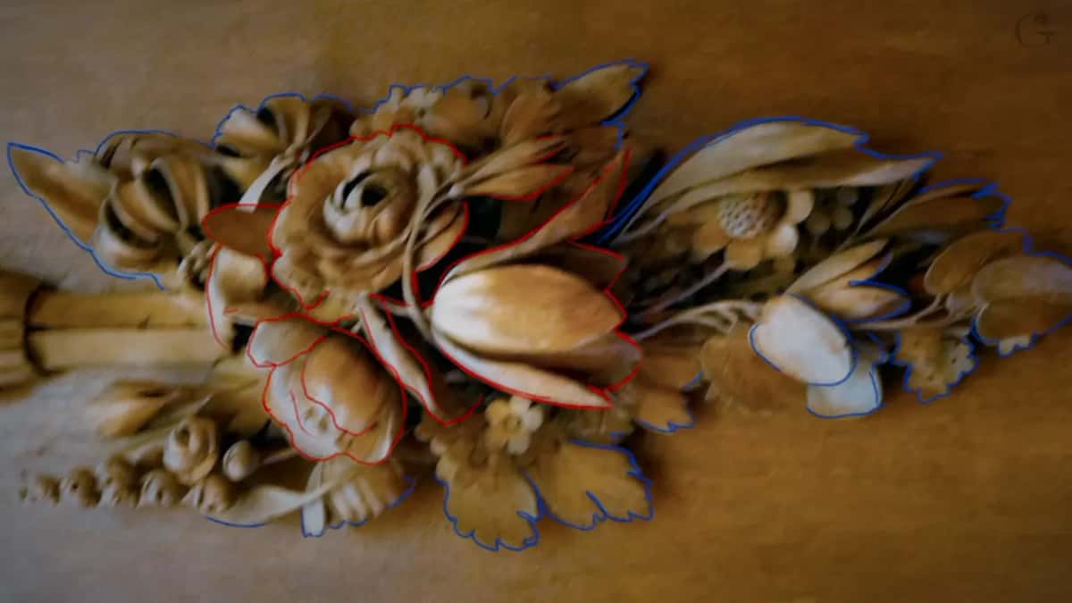 The original design in a photograph, his upper layer ringed in red and the lower one in blue