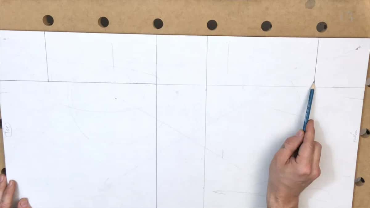 Pencil tip resting exactly where two layout lines cross