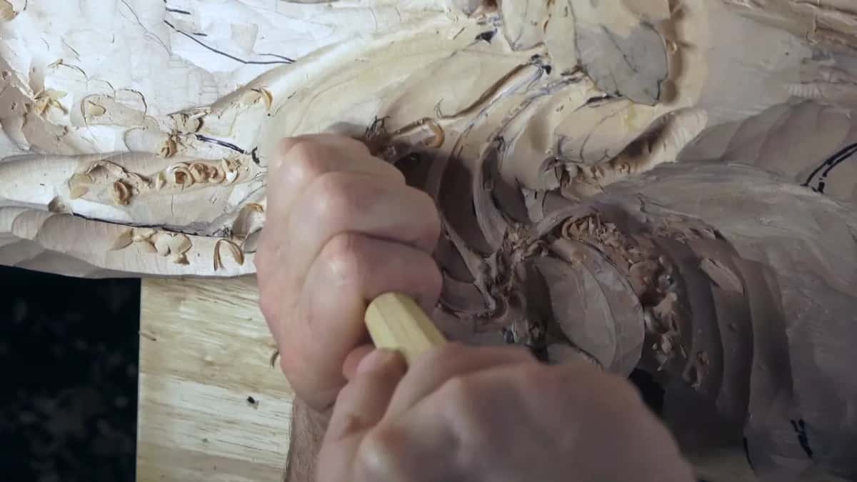 Light handle, blade deep in a hollow beside the big curl.