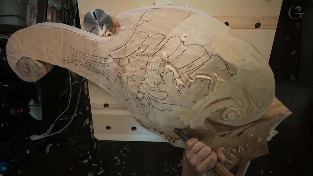 Gouge held low along the bottom edge of the corbel