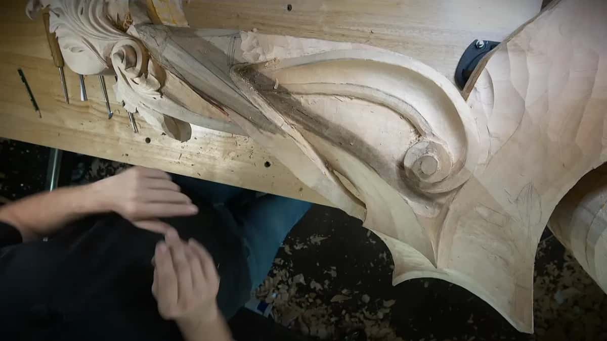 Corbel side from above, big scroll at one end, acanthus at the other