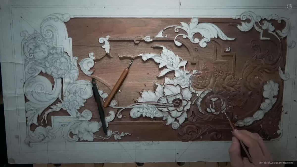 Whole panel from directly above, two tools lying on it and a hand at the lower right