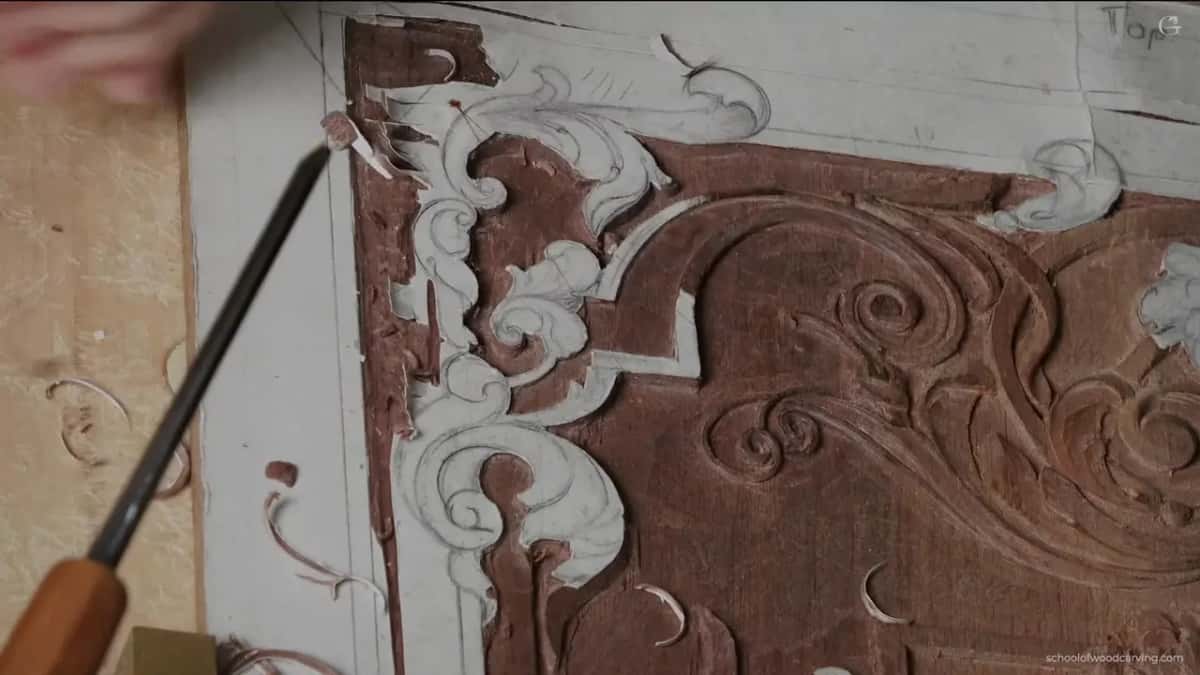 Orange handle, steel aimed into the corner