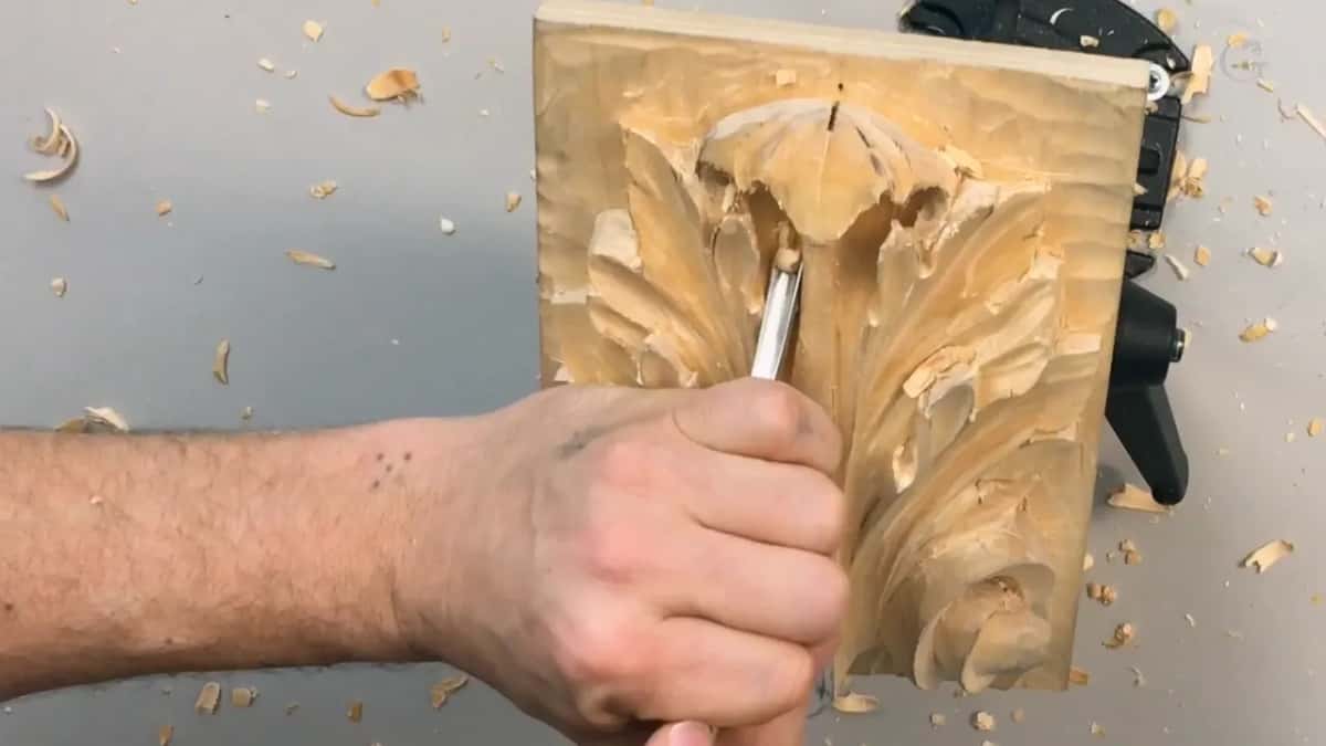 Closed hand and a steel blade right in the middle