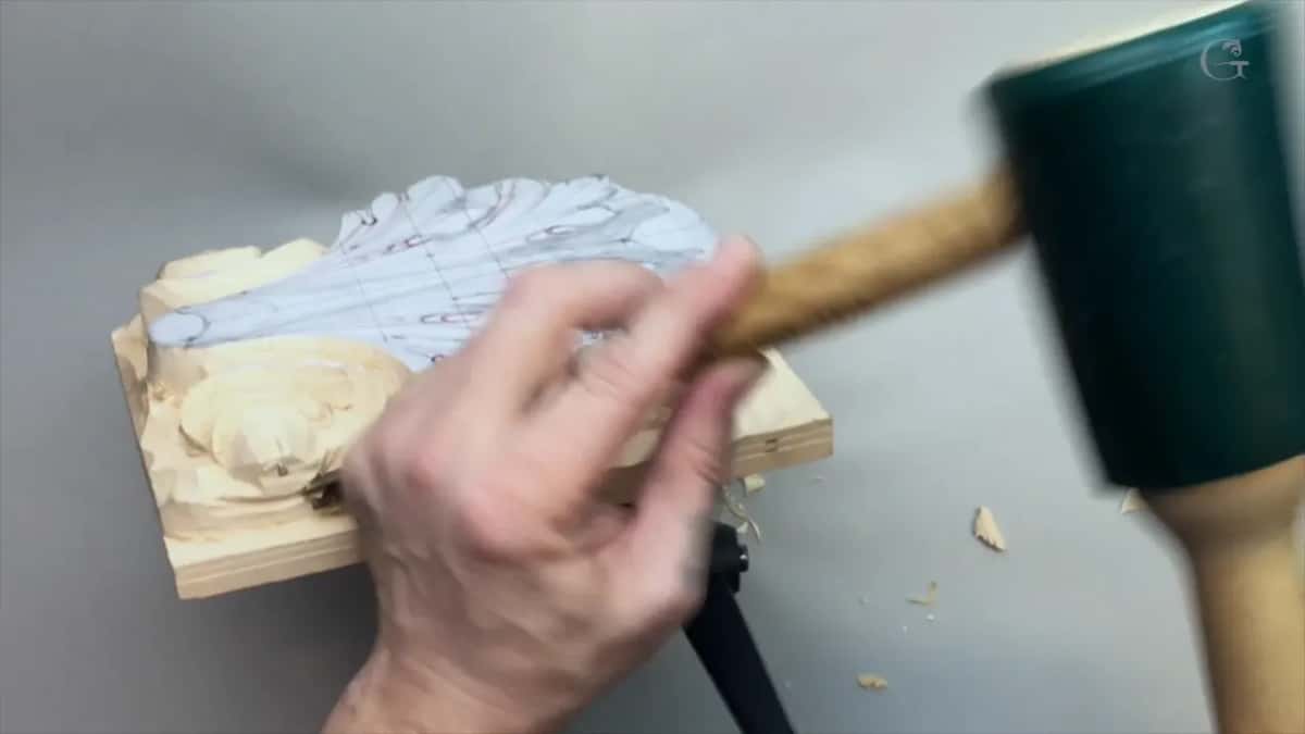 Green mallet blurred beside the panel