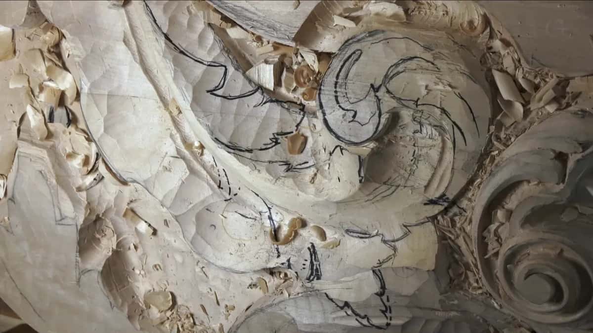 The traced scroll, sitting on the wood again.