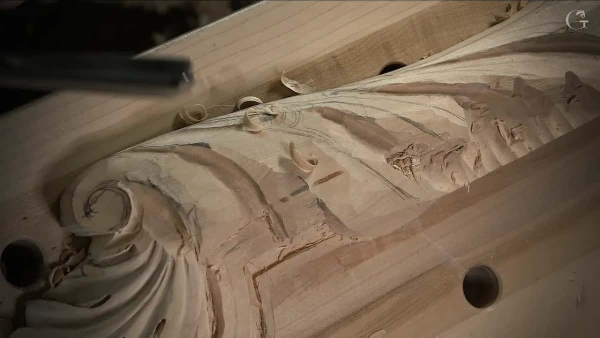 Close look at the scroll, small curls of wood in its hollow and pencil marks beside it
