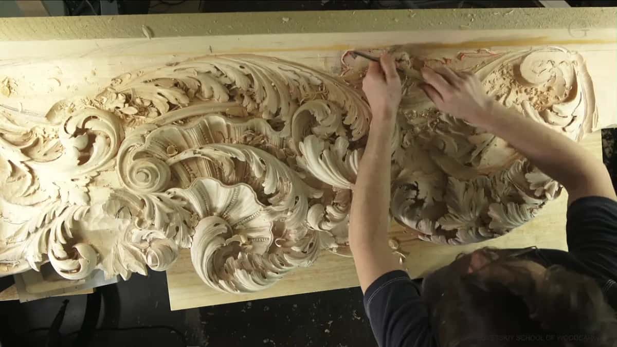 Both hands at work along the top middle
