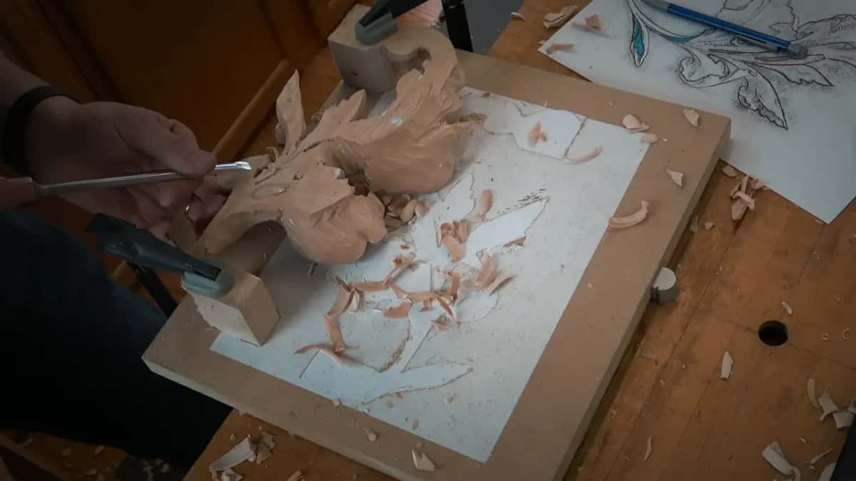 Leaf flipped face down under a clamp while a gouge works its back