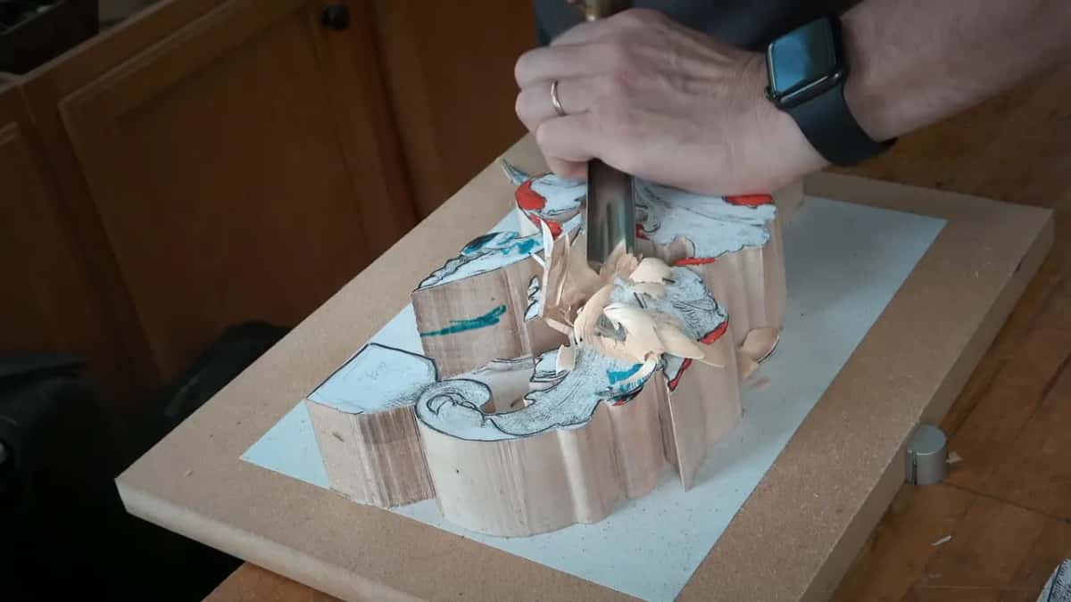More chips lift from the hollowed middle as the gouge sinks